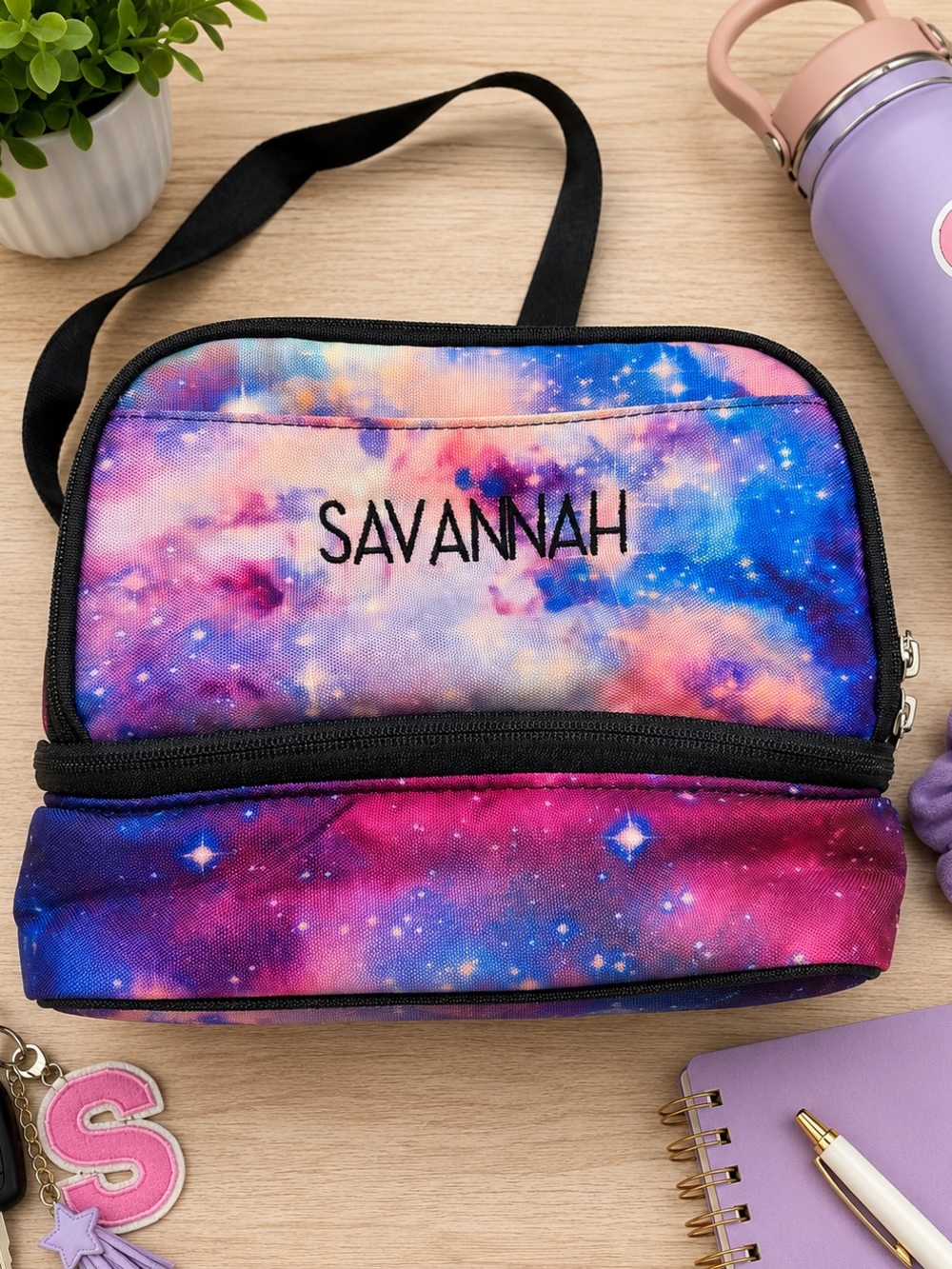 Colorful Pottery Barn Teen lunch bag featuring a vibrant galaxy print in shades